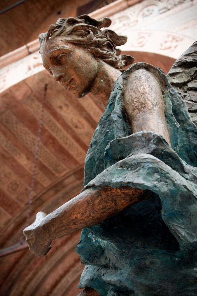 Angel statue at the Cattedrale di Santa Maria Matricolare, Verona, Italy, March 2024