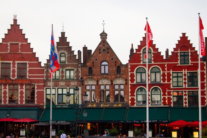 Crow-stepped gables in Markt in Bruges, Belgium, April 2024